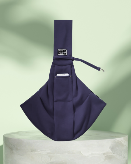 Navy blue sling bag on a light green background