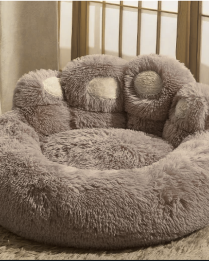 Fluffy gray pet bed with soft texture on a neutral background