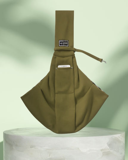 Brown sling bag on a light green background