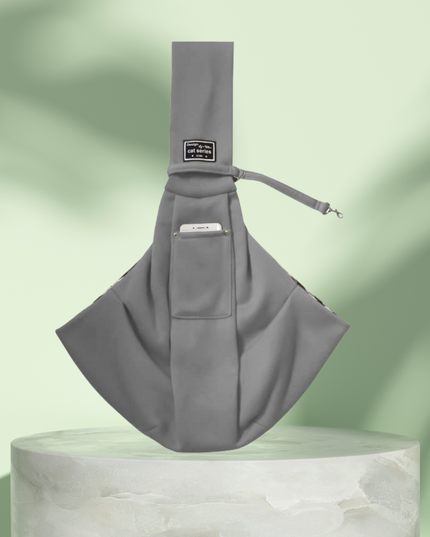 Gray sling bag on a light green background