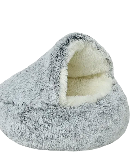Gray fuzzy pet bed with white interior on a white background