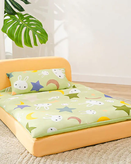 Children's bed with cartoon design on a light wooden floor.