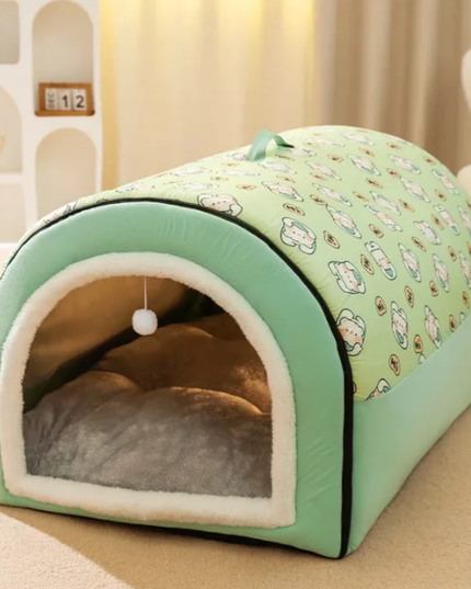 Green pet bed with a pattern on a beige surface