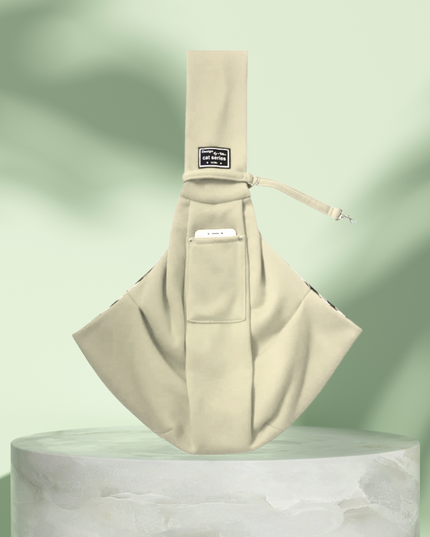Beige baby sling on a light green background