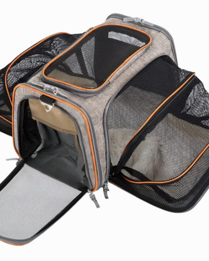 Pet carrier with mesh sides on a white background