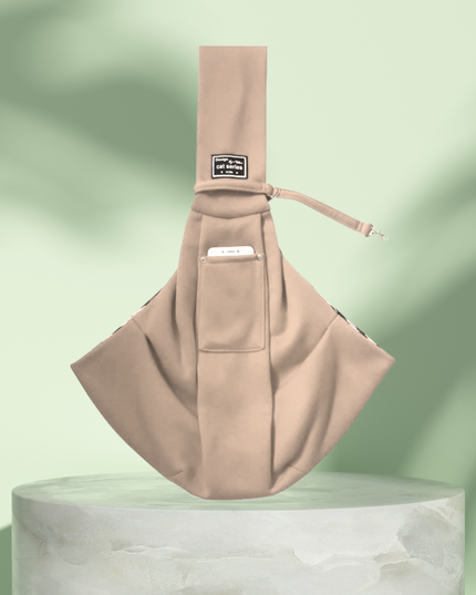 Beige sling bag on a light green background