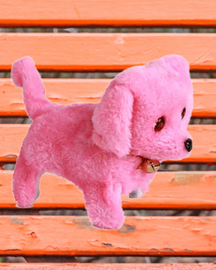 Pink plush toy dog on an orange wooden bench