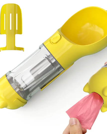 Yellow ice cream maker with clear middle section and pink scoop on a white background