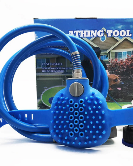 Blue pet grooming tool with a hose attachment in front of a product packaging box.