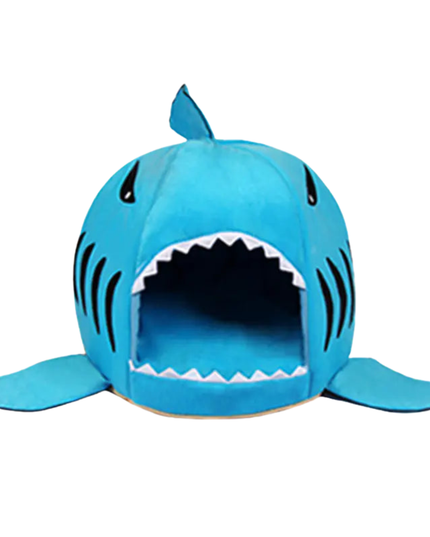 Blue shark-shaped pet bed on a white background