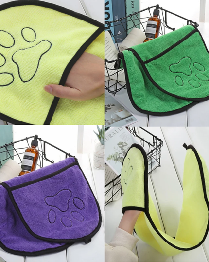 Four microfiber cloths with paw prints in different colors on a white background.