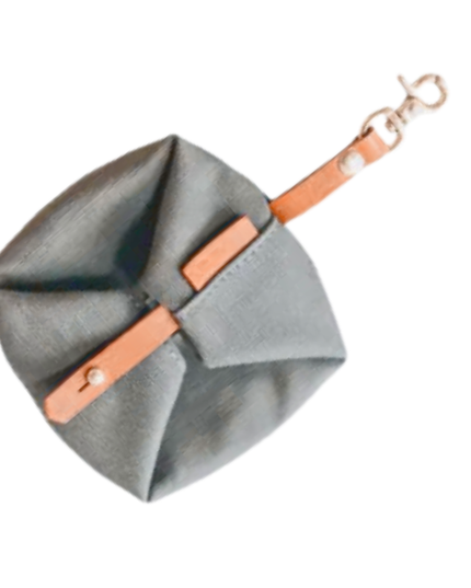 Gray pouch with a brown strap on a white background