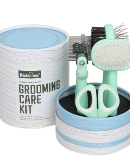Grooming care kit with scissors, brush, and comb in a cylindrical container on a white background.