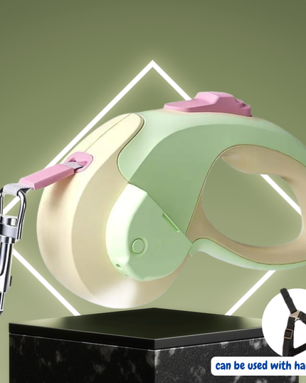 Pet leash with pink handle and green body on a green background