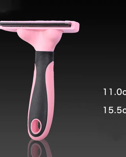 Pink and black pet grooming brush on a black background with measurements displayed.