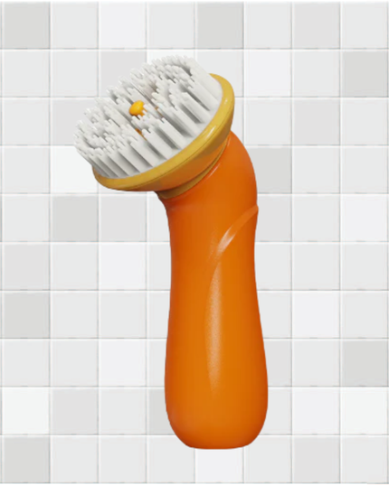 Orange scrubber with white bristles on a tiled wall background