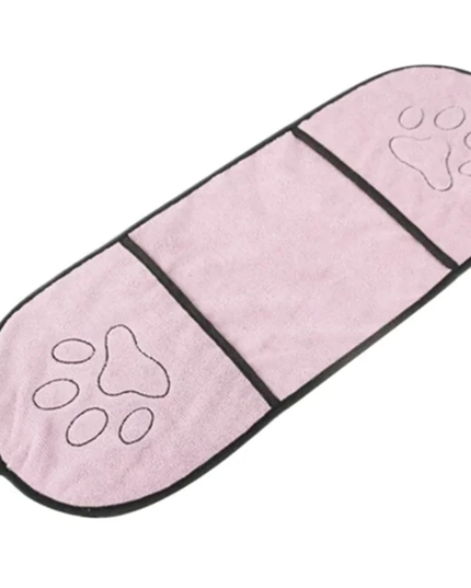Pink pet mat with paw print designs on a white background