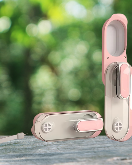 Pink and silver door lock set against a blurred green outdoor background