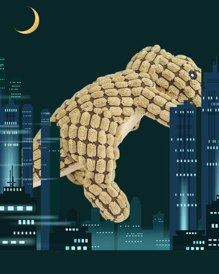 Dog toy shaped like a dog in front of a cityscape at night