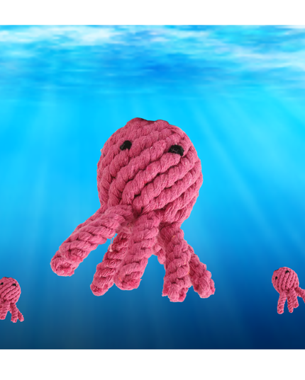 Pink knitted octopus toy with smaller versions on a blue underwater background