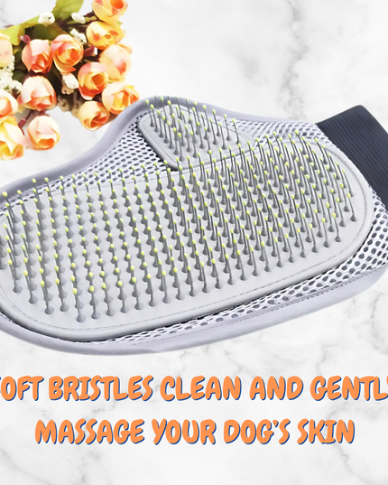 Pet grooming brush with soft bristles on a white surface with flowers in the background