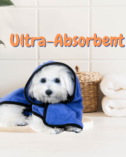 Dog wearing a blue towel with 'Ultra-Absorbent' text in a bathroom setting