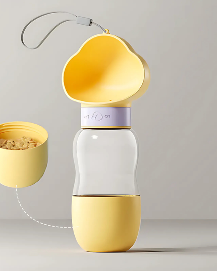 Yellow and white portable pet feeder with detachable bowl on a gray background