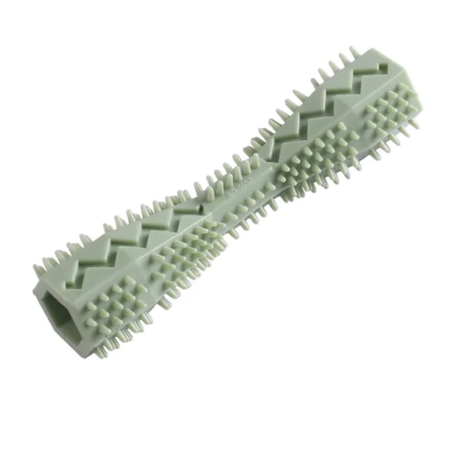 Green plastic tool with textured surface on a white background