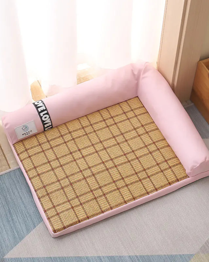 Pink cushion with a woven mat on a light-colored floor.