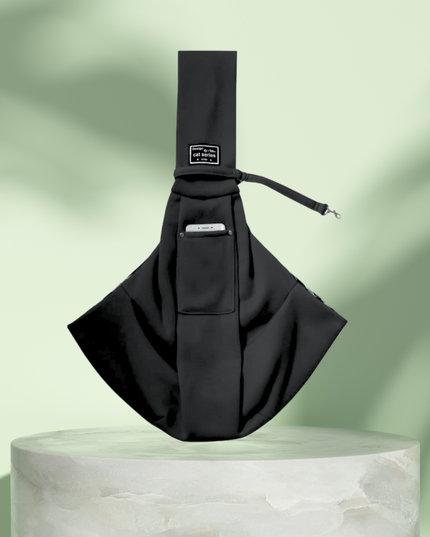 Black sling bag on a light green background