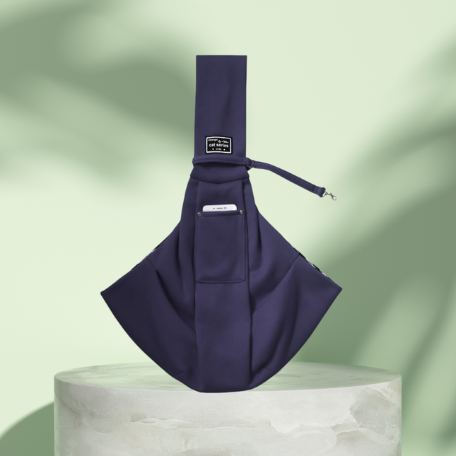 Navy blue sling bag on a light green background
