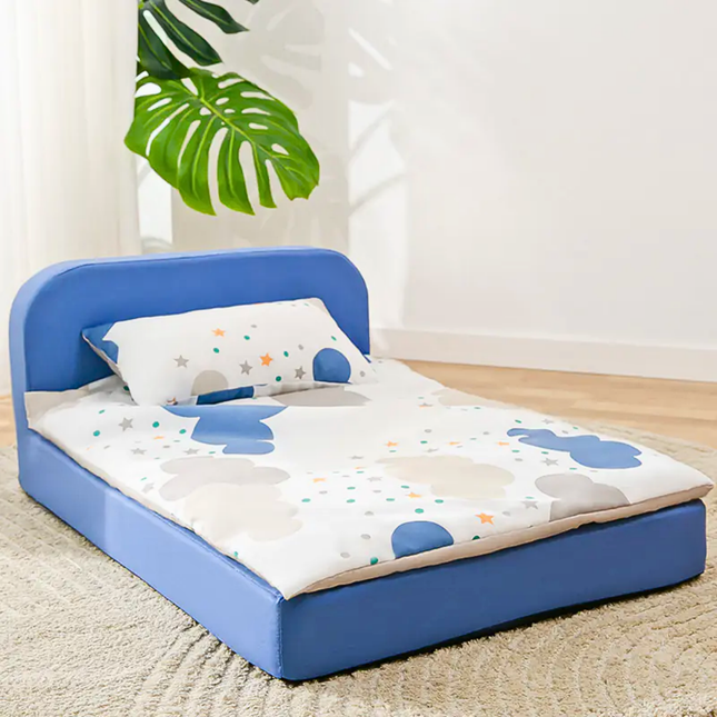 Children's inflatable bed with blue frame and cartoon design on mattress, indoor setting.