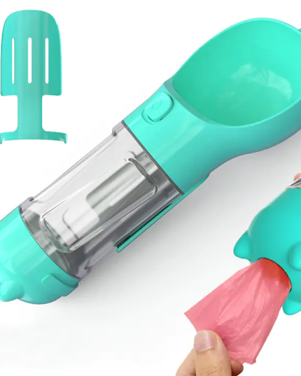 Teal baby bottle cleaning brush with pink cleaning pad on a white background