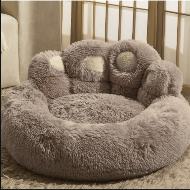 Fluffy gray pet bed with soft texture on a neutral background