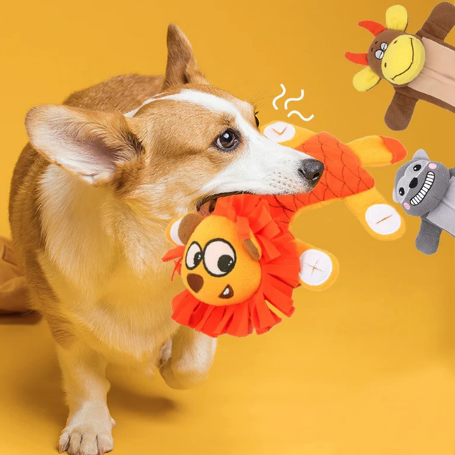 Dog playing with a colorful toy on a yellow background