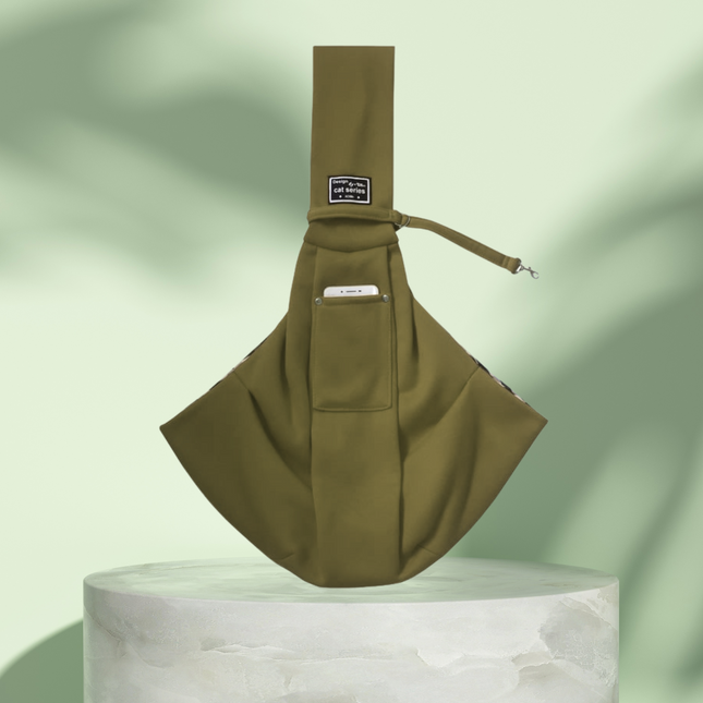 Brown sling bag on a light green background