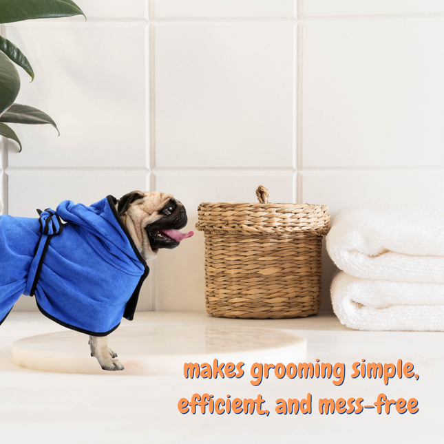 Dog wearing a blue grooming cape in a bathroom setting with text overlay.