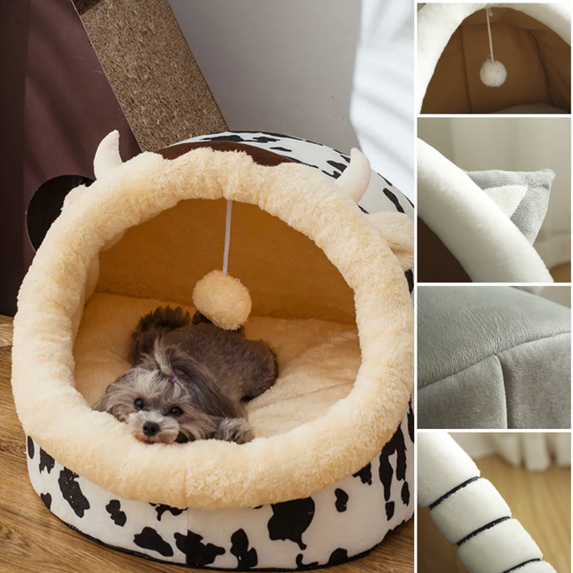 Pet bed with cow print and plush interior, featuring a small dog inside.