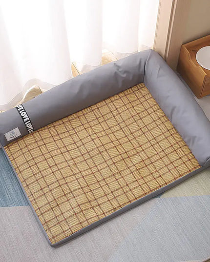 Roll-up bamboo mat with gray border on a bed in a bedroom setting
