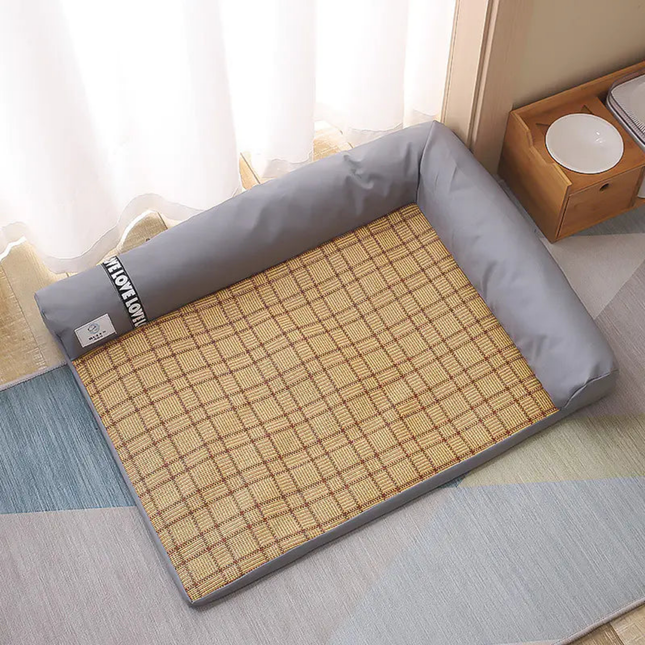 Roll-up bamboo mat with gray border on a bed in a bedroom setting
