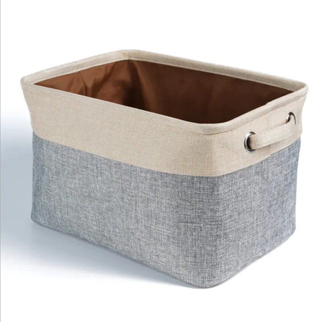 Storage basket with beige top and gray bottom on a white background