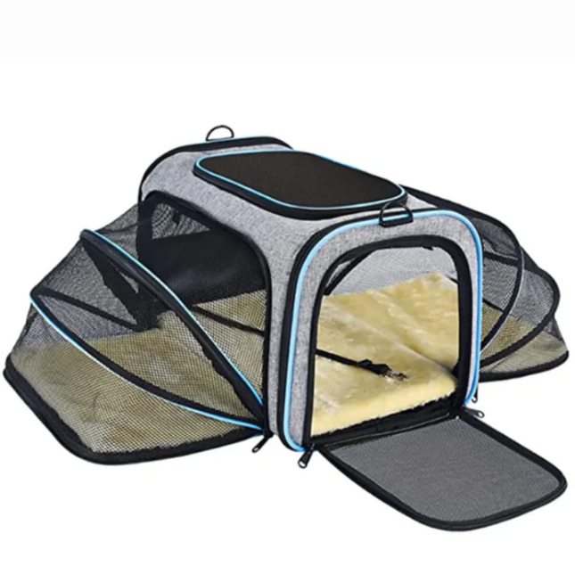 Pet carrier with open front panel on a white background