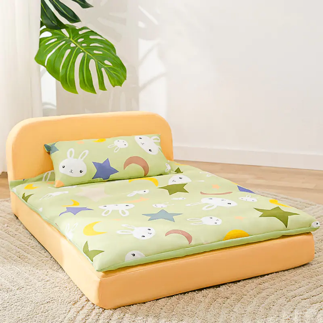 Children's bed with cartoon design on a light wooden floor.