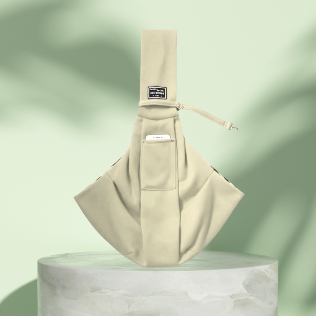 Beige baby sling on a light green background