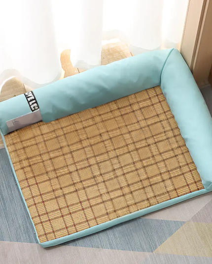 Pet bed with a checkered design and light blue padding on a floor.