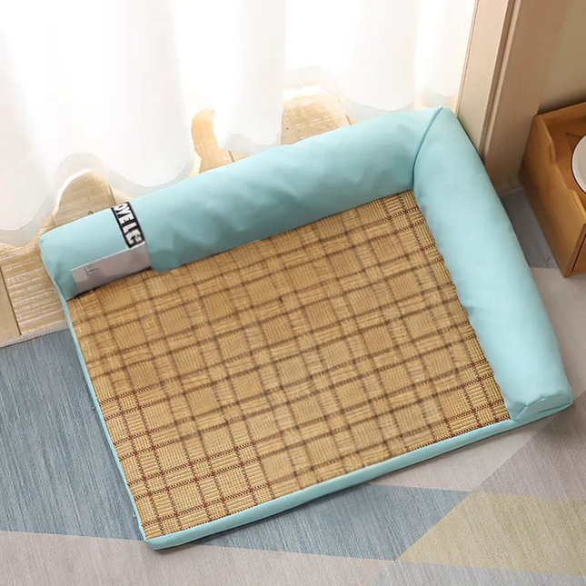 Pet bed with a checkered design and light blue padding on a floor.