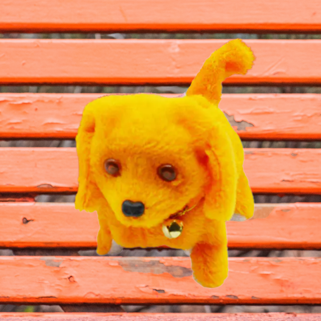 Yellow plush dog toy on a wooden bench