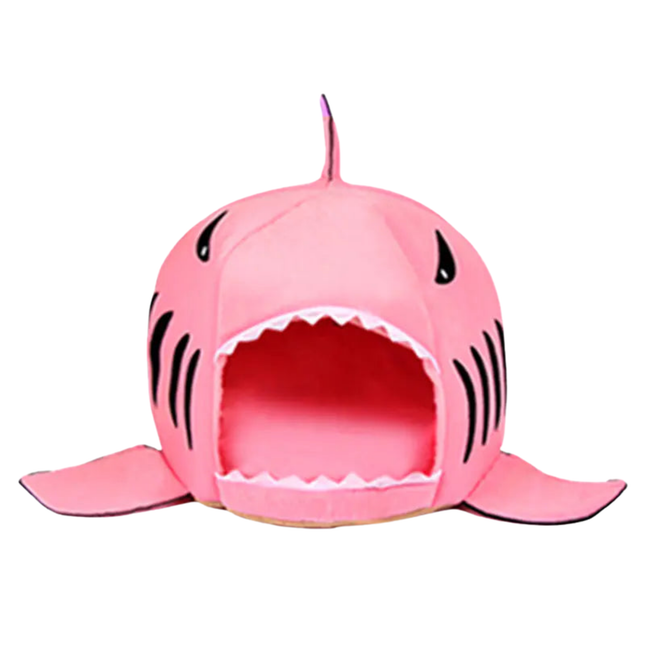 Pink shark-shaped pet bed on a white background