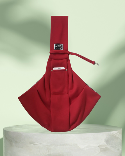 Red sling bag on a light green background