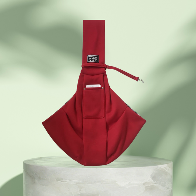 Red sling bag on a light green background